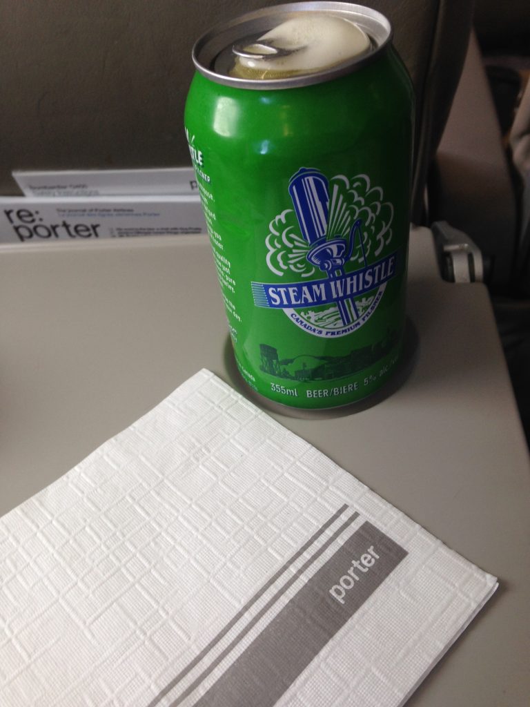 Complimentary beer or wine or pop or coffee/tea from Porter Airlines